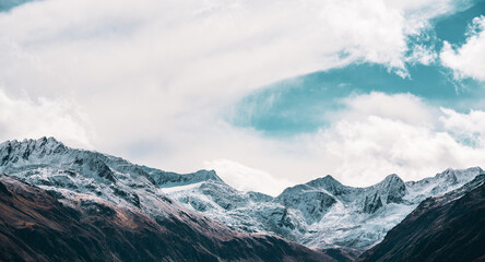 Panoramic view of the Swiss Alps near the municipality of Andermatt in autumn.