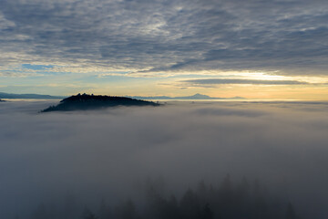 Fototapeta premium Island Hill Above Clouds At Sunrise Over Burnaby In Greater Vancouver, BC, Canada