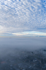 Obraz premium Aerial View Over Cloud Layer With Mountain Horizon And Beautiful Blue Sky At Dawn Today