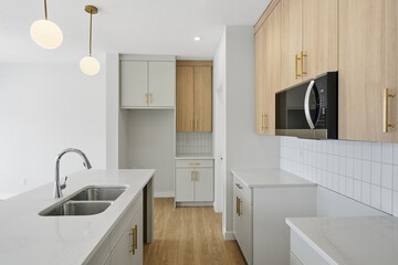 Kitchen with a white counter and a white sink