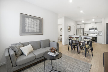 Living room with a couch, coffee table, and a framed picture on the wall