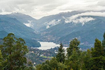 View of Cavado River, Vila do Geres and the Canicada Dam reservoir in the Peneda-Geres National Park, Portugal, on an overcast day.