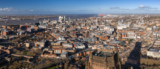 Aerial sunrise view of Liverpool, UK, showing Liverpool Cathedral, the Three Graces, Museum of...