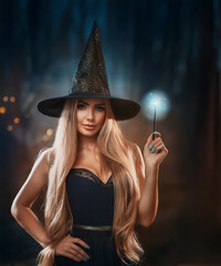 Glamorous and attractive witch or sorceress at Halloween