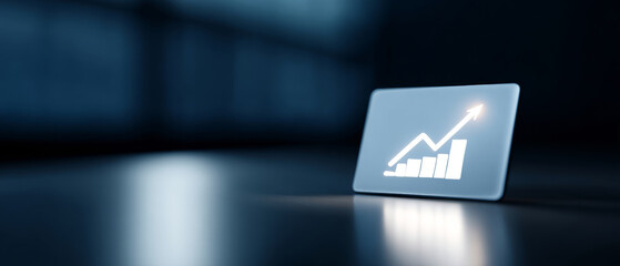 A glowing bar graph icon on a laptop screen symbolizes financial growth and success in business endeavors