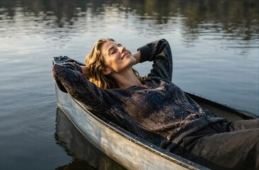 Woman relaxing in canoe enjoying peaceful lake serenity