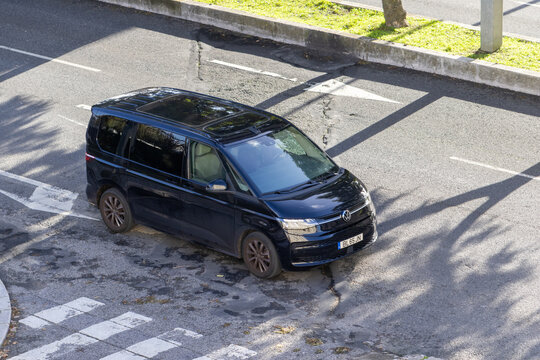 Volkswagen multivan t7 black van parked city street
