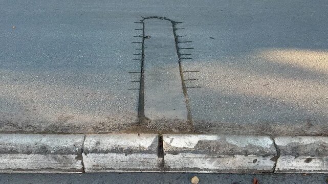 Place of selection of the kernel in the form of a rectangular from asphalt concrete pavement. Kern. Close-up.