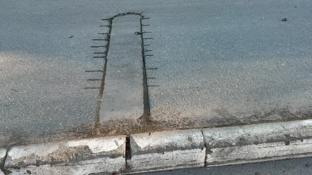 Place of selection of the kernel in the form of a rectangular from asphalt concrete pavement. Kern. Close-up.