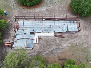 Barndominium red iron framing house or workshop build aerial overhead