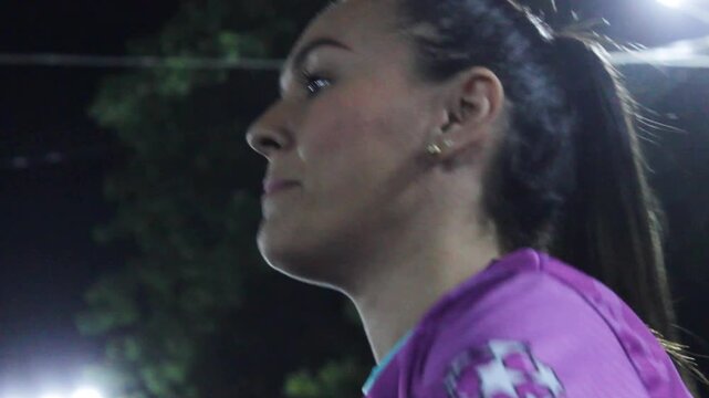 Portrait of a young Latina woman during a soccer game on a field at night in Neiva, Huila, Colombia. Concept of sports 