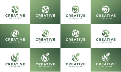 A grid of twelve distinct 'N' letter logos, each incorporating a leaf or organic element within a circular design, presented in green and white tones for branding purposes.