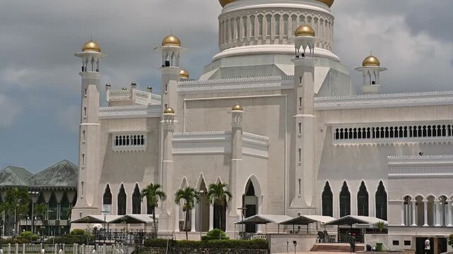 The late afternoon sun sets over Bandar Seri Begawan, Brunei, and strikes the facade of the Sultan Omar Ali Saifuddin Mosque.