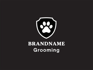 Pet Grooming Logo with Paw Print Shield. © Arip