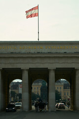 Traditional Fiaker carriage passing under the historic Burgtor i