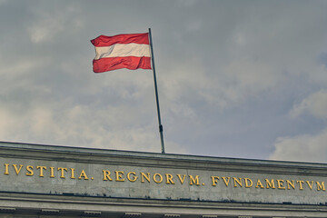 Austrian flag flying above the Palace of Justice in Vienna with