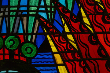 Vibrant abstract stained glass pattern featuring bold geometric