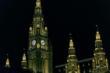 Night illumination of the central clock tower of the Neo-Gothic Vienna City Hall (Rathaus).