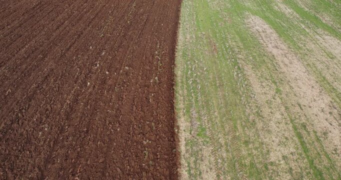 Good and bed. Half plowed soil on agriculture field in spring. Preparation for soybeen, wheet, rye seeding. Aerial shot