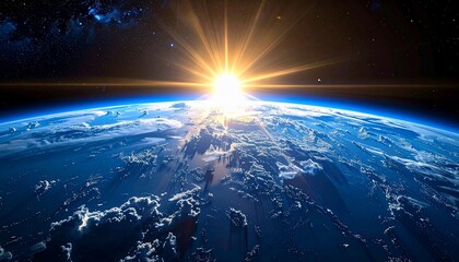 Sunrise over Earth from space, showing continents, clouds, and radiant sunlight