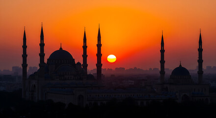 Fototapeta premium Dramatic Sunset Silhouette of a Mosque: Religious and Architectural Landmark, Islamic Culture, Travel and Tourism Concept