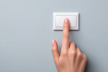 Finger touching white wall switch in minimalist interior with soft lighting conveying simple action and calm mood