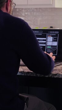 Middle Aged Man Runs Tax Assessment for Home Based Small Business Preparing for Tax Season and Prepayments Concept