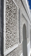 Ornamental White Facade Design With Intricate Patterns