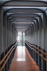 Fototapeta premium The futuristic Gelora Bung Karno pedestrian bridge glows with vibrant colors at night to showcase the modern architectural and urban connectivity of Jakarta