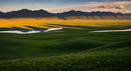 Scenic landscape of green fields rivers and mountains under golden sunlight