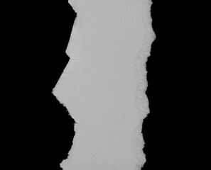 torn ripped paper on black background.