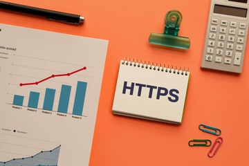 There is notebook with the word HTTPS. It is an abbreviation for Hypertext Transfer Protocol Secure as eye-catching image.