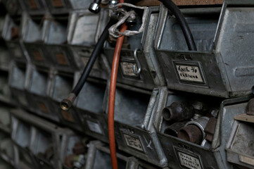 Fototapeta premium Detailed view of industrial storage compartments containing brass plumbing fittings and hardware components