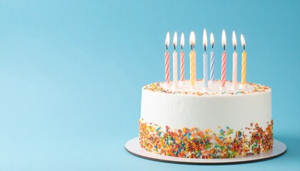 Festive White Birthday Cake with Rainbow Sprinkles and Lit Candles