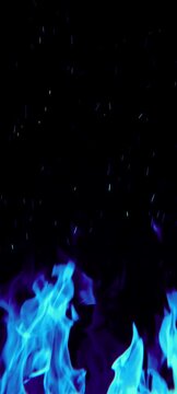 Video gerakan lambat api berwarna biru elektrik yang menyala dengan percikan api (embers)yang terbang ke atas.Latar belakang hitam pekat memberikan kesan kontras yang tajam, cocok untuk latar belakang