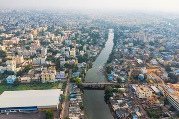 Aerial view of colorful homes by the canal in Vijayawada city, is a second largest city in the state of Andhra Pradesh in India