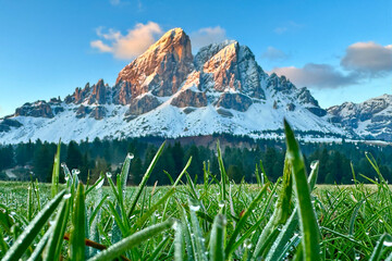 Sass de Putia Peak Reflected in a Crystal Clear Alpine Tarn during Golden Hour with beautiful clear...