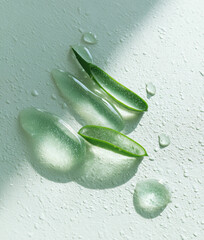 Aloe vera leaf with hydrating gel on textured surface