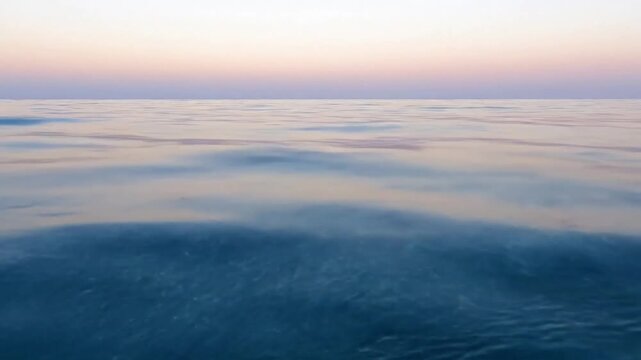 Golden Hour Ocean Shimmer Low angle capturing the elongated sun path on the water's surface as the sun approaches the horizon, creating a warm, vibrant