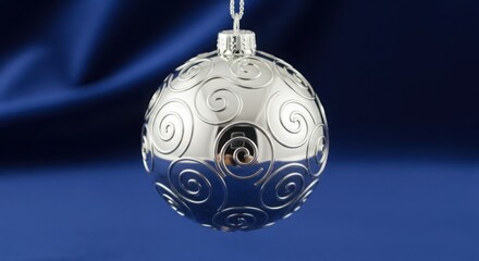 Elegant Silver Christmas Ornament with Celtic Knot Design Hanging on Tree