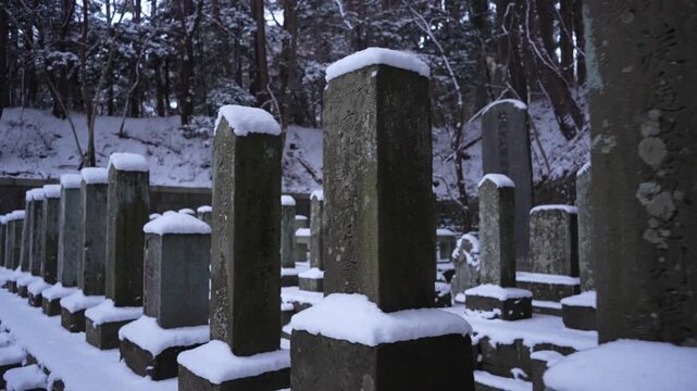 Rows of snow covered stones in Hakodate Gokoku Shrine Hakodate Japan. Medium shot