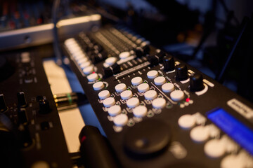 Engineer finetuning sound signals using patch cables, Focused technician adjusting levels on electronic patch cable setup with vivid colorful plugs and tactile interfaces