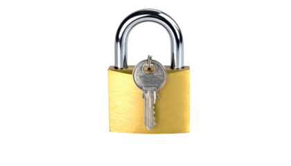 A close-up view of a new brass padlock with its key inserted, isolated on a black background, suggesting security