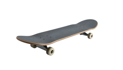 An angled studio shot of a skateboard with a dark gray grip tape, wood deck, and off-white wheels, against a black backdrop