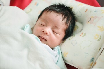 baby sleeping in bed