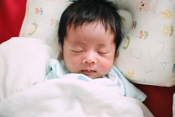 baby sleeping in bed