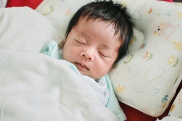 baby sleeping in bed