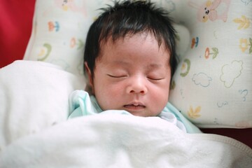 baby sleeping in bed