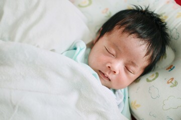newborn baby boy sleeping
