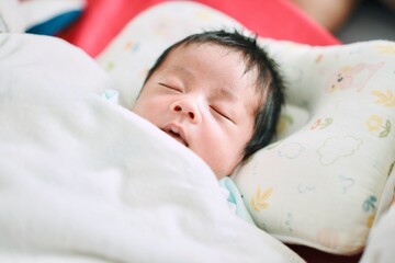 baby sleeping in bed